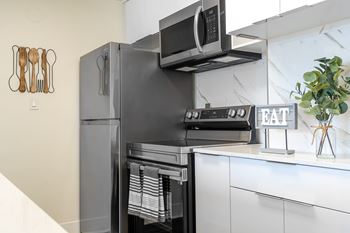 Kitchen with black refrigerator